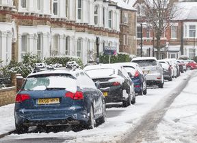 cars-parked-along-a-snow-covered-street