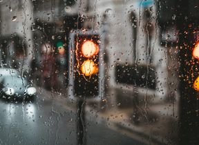 raindrops-on-window-blurred-traffic-background
