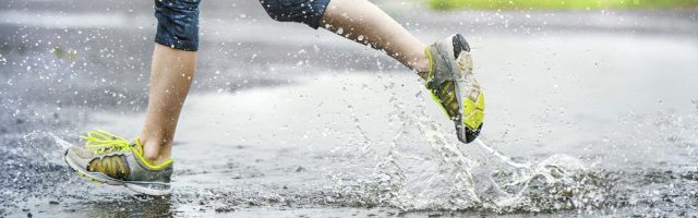 Close up of someone running in the rain