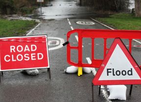 signs-marking-a-flooded-road
