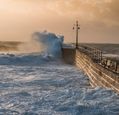 storm-waves-crashing-against-a-harbour-wall