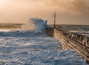 storm-waves-crashing-against-a-harbour-wall