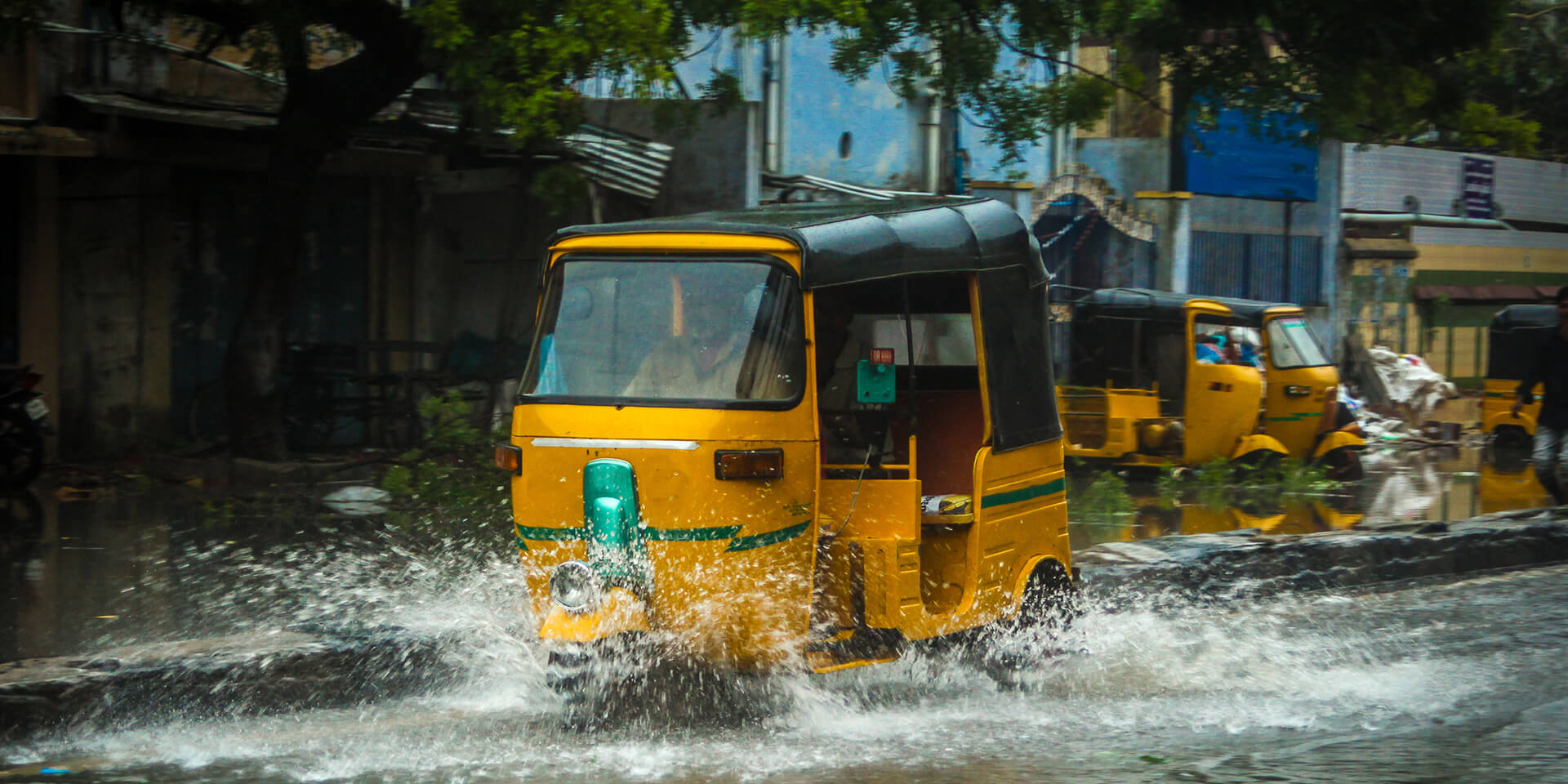 tuk-tuk-driving-through-flood-water