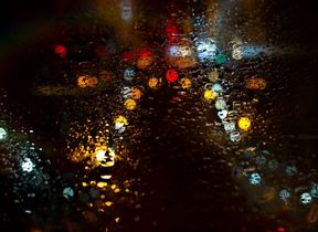 wet-pavement-with-reflections-of-christmas-lights-adobe-stock
