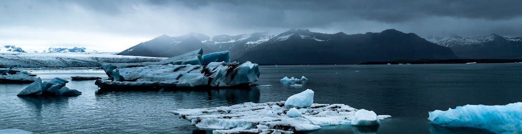Icebergs beneath a grey sky Photo Emma Hall