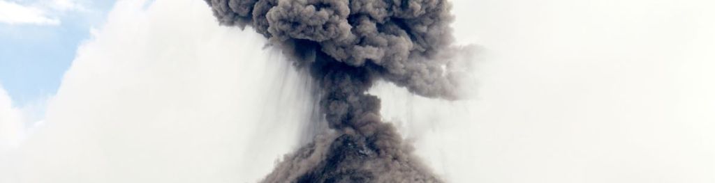 A volcano erupting ash