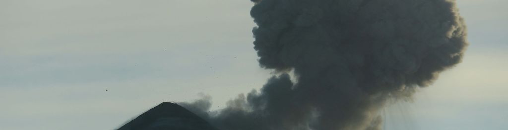 A volcano erupting ash