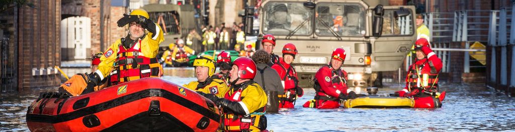 Emergency rescue team in action in a flooded town.