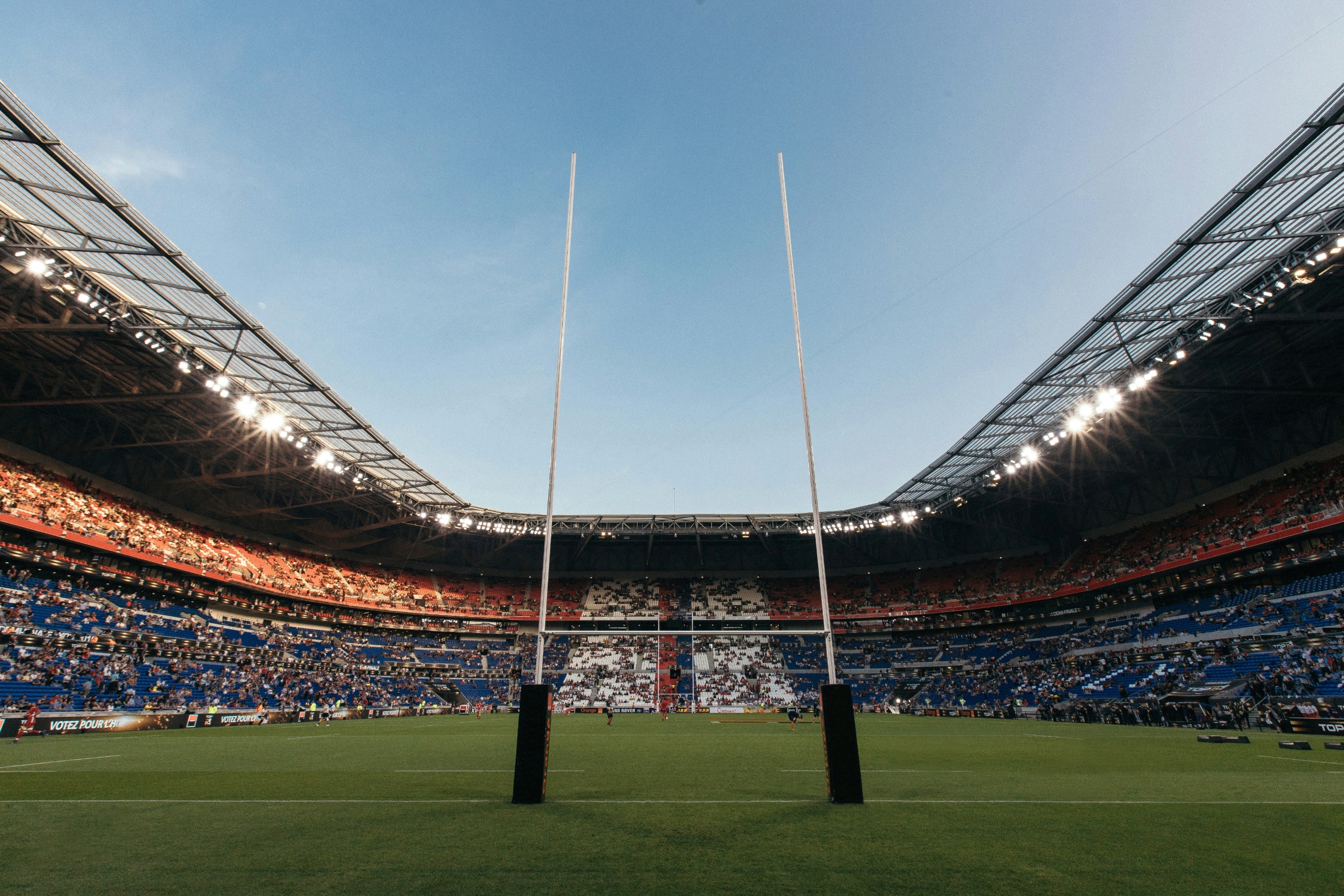 Rugby pitch in a stadium from behind the posts.